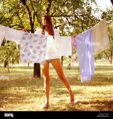 Girl Female Woman Age 20 25 Young Tall Brunette Hang Dry Laundry