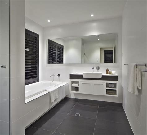Small bathroom pin en baños 15 bathrooms with amazing tile flooring floor white subway walls classic black and tiled trends at lowe s design. Image result for modern bathroom black floor white walls ...