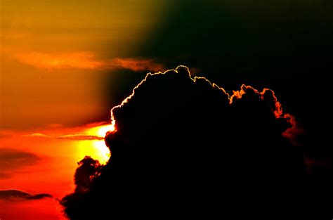 Free Stock Photo Of Sun Behind A Dark Cloud
