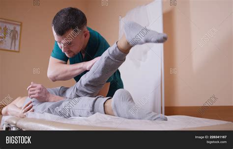 Chiropractor Massaging Image And Photo Free Trial Bigstock