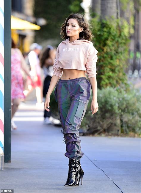 Olivia Culpo Bares Her Midriff In Inclusion Hoodie Before Digging