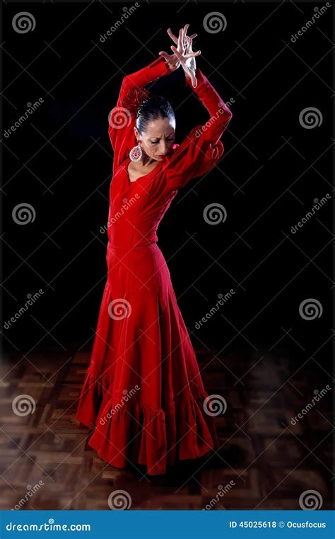 Young Spanish Woman Dancing Flamenco In Traditional Red Dress Stock
