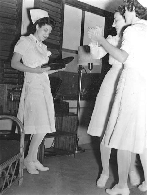 Black And White Photograph Of Two Women In Nurses Uniforms
