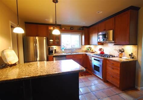 We specialized in kitchen cabinet, wardrobe and carpentry works to create your ideal home. StarMark cherry toffee and java kitchen with Cambria ...
