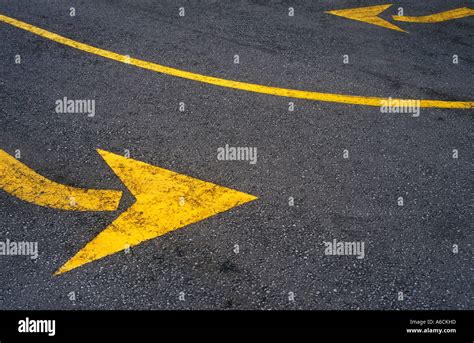 Two Traffic Arrows On A Road Facing Opposite Directions Stock Photo Alamy