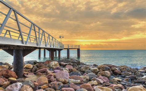 Sunset Sea Coast Rocks Bridge Ocean Wallpaper Hd