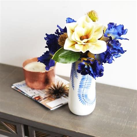 Cream Magnolia Blue Iris And Thistle Everyday Spring Summer Floral Arrangement In White And Blue
