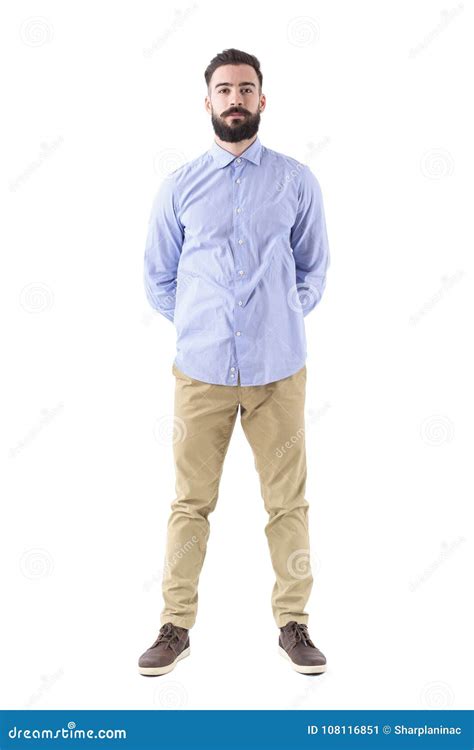 Front View Of Young Smart Casual Bearded Man Standing With Hands On