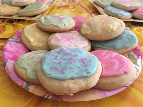 If you want the sprinkle decorations to stick directly on the cookie, brush the cookie with clear karo syrup and then sprinkle. cookie icing without corn syrup