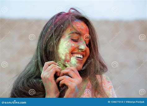 Closeup Portrait Of Emotional Brunette Woman Celebrating Holi Colors