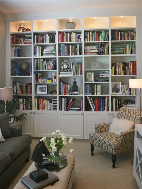 A Living Room Filled With Lots Of Furniture And Bookshelves Next To A Couch