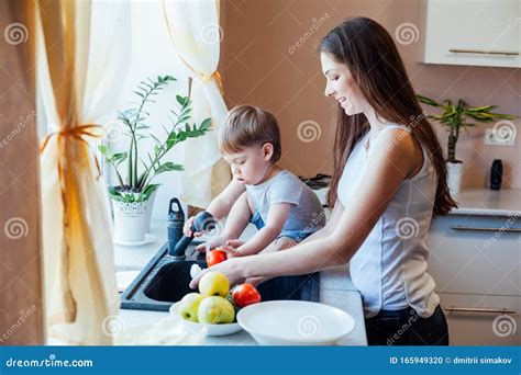Kitchen Mom Son Wash Fruits And Vegetables Stock Photo Image Of