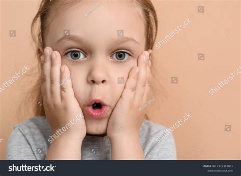 Portrait Surprised Little Girl On Color Stock Photo 2112318851