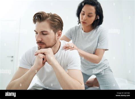 Affectionate Lady Giving Her Life Partner Relaxing Massage Stock Photo