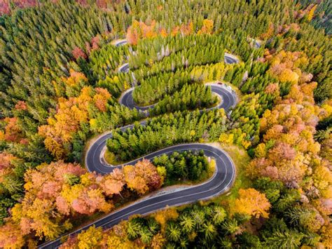 Winding Road In The Mountains In The Middle Of The Autumn Stock Photo
