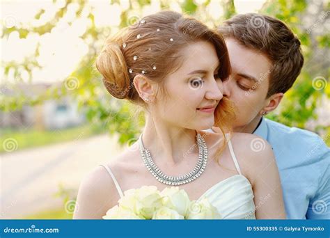 Groom Kisses The Bride On Walk On Their Wedding Day Stock Image Image