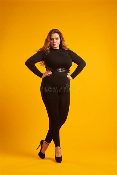 Curvy Girl In Tight Fitting Clothes Posing With Her Hands On Hip Stock Image Image Of Hair