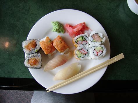 Free Photo Plate Of Sushi Close Up Mouth Watering Wooden Table