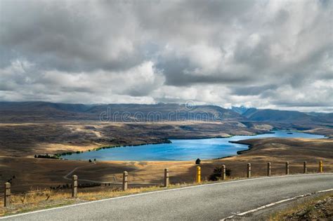 Road In The Mountains Lake Tekapo And Dramatic Cloudy Sky North