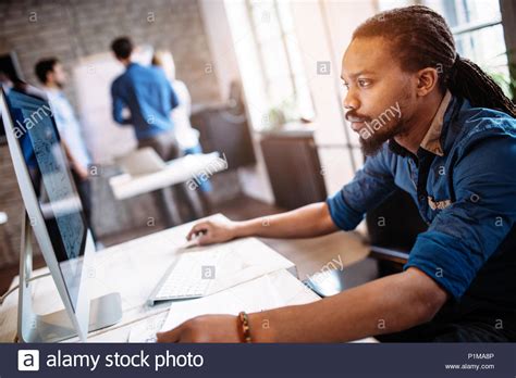 Young Architect Working On Computer In Office Stock Photo Alamy