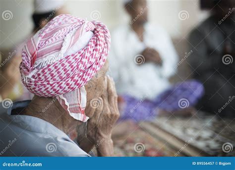 Old Muslim Man With Turban Blowing A Trumpet Editorial Image