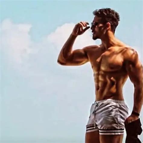 tiger shroff flaunts chiselled physique and flashboard abs in stunning beach photo check