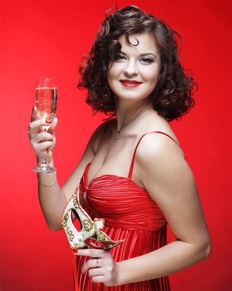 Premium Photo Woman In Red Dress With Glass Of Champagne