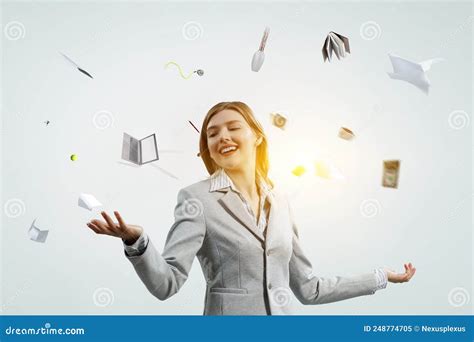 Young Pretty Businesswoman Juggling With Business Items Stock Image