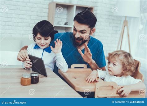 Father Of Boys Is Engaged In Raising Children Stock Image Image Of