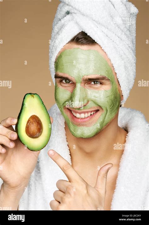 Happy Smiling Man With Facial Mask Of Avocado Photo Of Well Groomed Man Receiving Spa