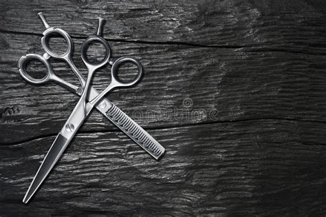 Hairdressing Different Scissors Isolated On Black Wooden Stock Image