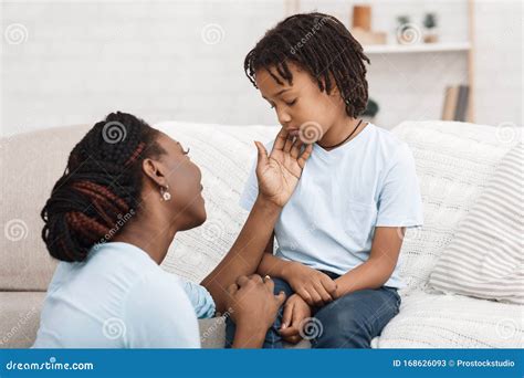Black Mom Caressing Her Depressed Kid On Sofa Stock Image Image Of