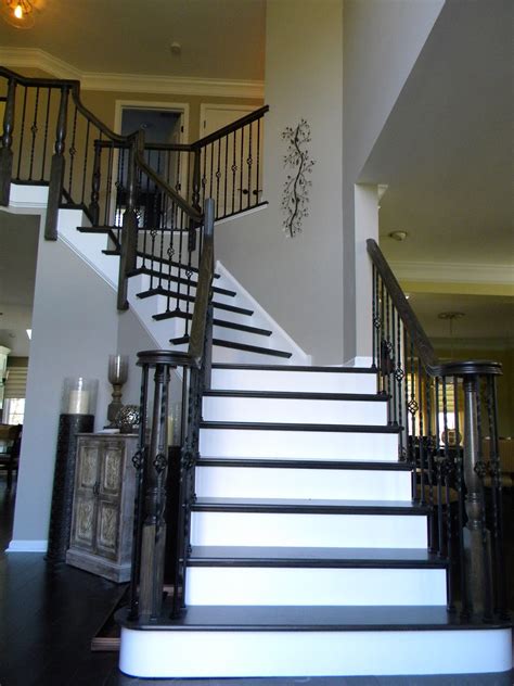 Wood Stairs And Rails And Iron Balusters