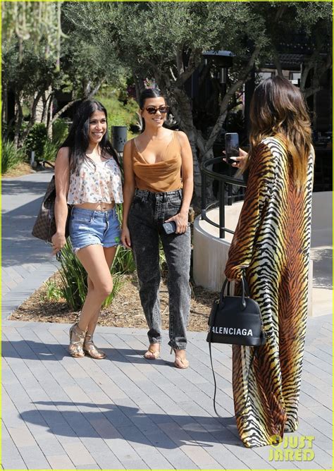 kourtney kardashian pairs plunging top with acid wash jeans for lunch in la photo 4353983