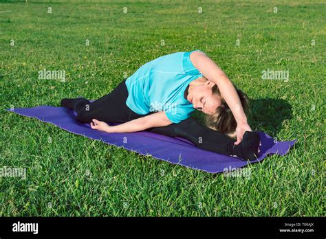 Funny Photo About Young Woman Doing Yoga Exercise With Funny Grimace