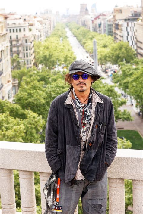 Johnny Depp Poses For Photographers During The Presentation Of His Film