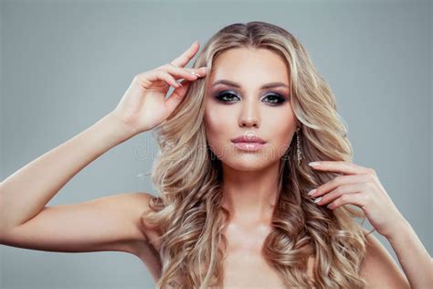 Fashion Portrait Of Perfect Blonde Woman With Long Curly Hair Stock