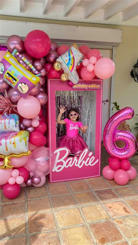 A Barbie Birthday Party With Balloons And Decorations