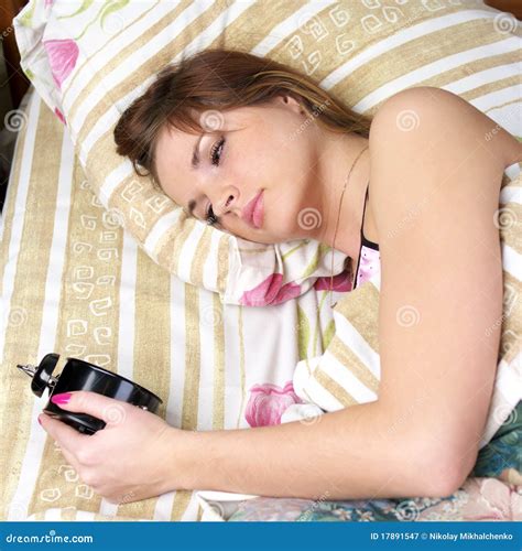 Drowsy Womanl In Bed Looking Stock Image Image Of Bell Holding 17891547