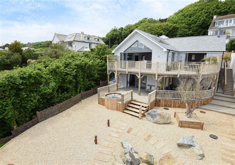 Tour This Breathtaking New England Style Beach House For Sale In