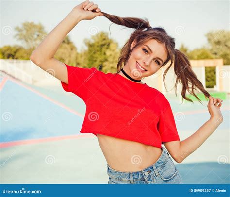 Young Redhead Woman In Pulling Ponytail And Smiling Hipster Summer