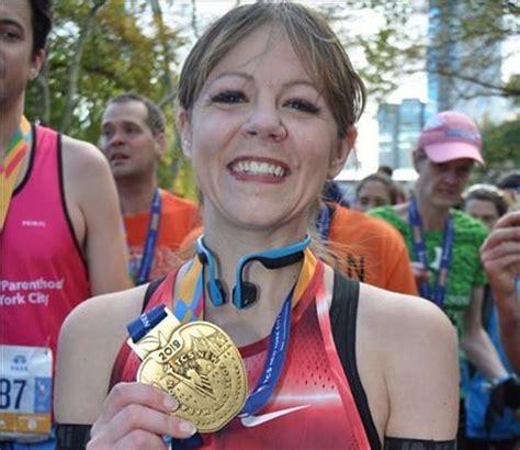 The Real Story Behind This New York Marathon Finish Line Photo