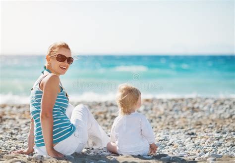 Mother With Baby Sitting On The Beach Stock Image Image