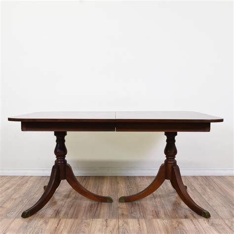 This Duncan Phyfe Dining Table Is Featured In A Solid Wood With A