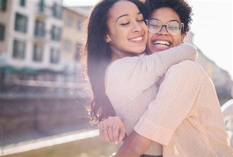 Black Affectionate Female Friends Having Fun In The City By Simone Wave