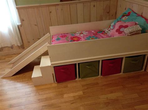 Diy toddler bed rail free plans built for under $15. DIY toddler bed with small slide and toy storage. | Diy ...