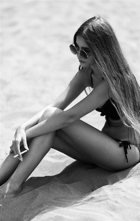 Young Woman Relax On The Beach By Stocksy Contributor Alexey Kuzma Stocksy