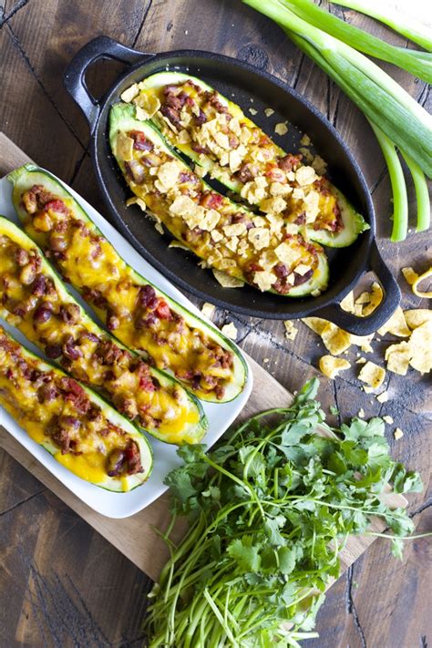 These easy stuffed zucchini boats are the perfect light summer dinner! Chili Cheese Stuffed Zucchini Boats - Maebells