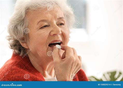 Elderly Woman Taking Pill At Home Stock Photo Image Of Cure Pill
