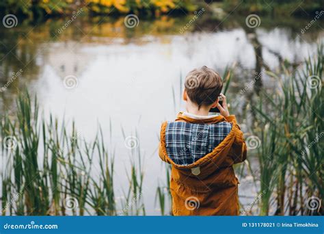 Cute Boy Walks And Poses In A Colorful Autumn Park Stock Image Image
